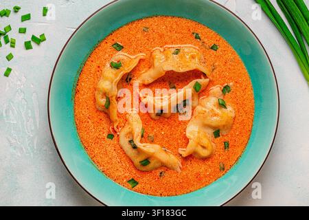 Coconut creamy dumpling soup or curry dumpling soup, top view. Stock Photo