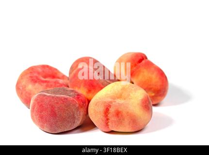 Flat peaches against a white background Stock Photo