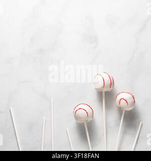 A minimalist arrangement of decorated cake pops and sticks. Stock Photo
