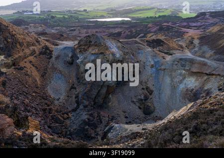 The unique colorful landscape of the historic Mynydd Parys copper mine represents centuries of industrial heritage in Anglesey. Stock Photo