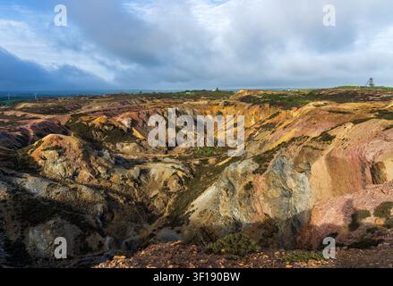The unique colorful landscape of the historic Mynydd Parys copper mine represents centuries of industrial heritage in Anglesey. Stock Photo