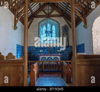 Ancient blue tiled sanctuary inside Eglwys Llanbadrig on the coast of Anglesey in Wales Stock Photo