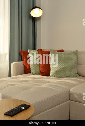 Soft decorarive throw pillows on a couch living room apartment interior Stock Photo
