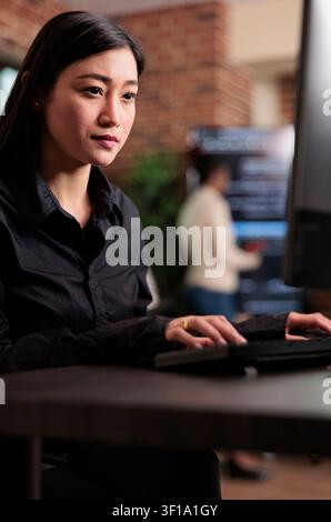 Application developer encrypting cloud storage database by updating network algorithm captures data protection, software systems and secure infrastructure in a technology workspace. Stock Photo