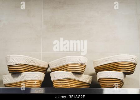 Traditional Proofing Baskets for Artisan Sourdough Bread in Bakery Stock Photo