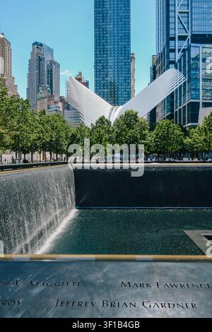 New York City, USA – June 8, 2026: Engraved names and cascading waterfall at the September 11 Memorial South Pool. Stock Photo