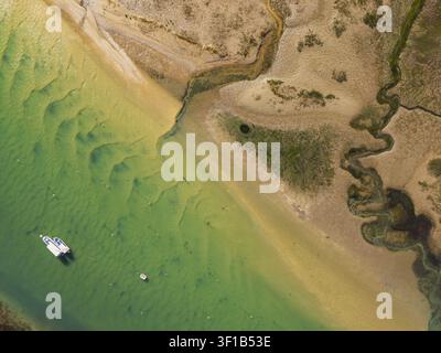 Aerial view of Sandbanks Beach featuring a white sandbar in turquoise ...