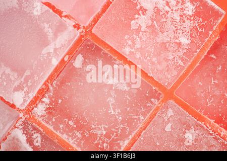 Colorful ice cubes on a flat surface during daylight hours Stock Photo