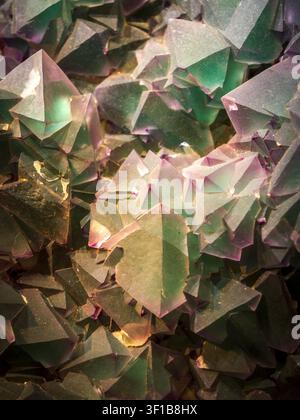Abstract crystal formation with geometric mineral texture background, showing natural stone detail, angular shapes, and earthy colors. Stock Photo