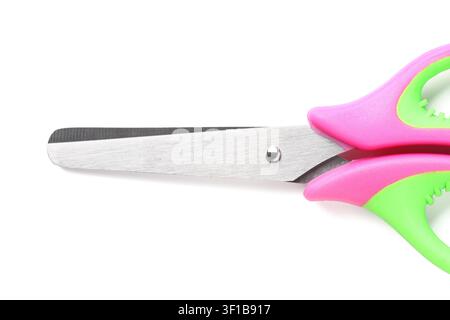 Pink and green childrens safety scissors with blunt metal blades, school supplies and crafting tools, isolated on a white background Stock Photo