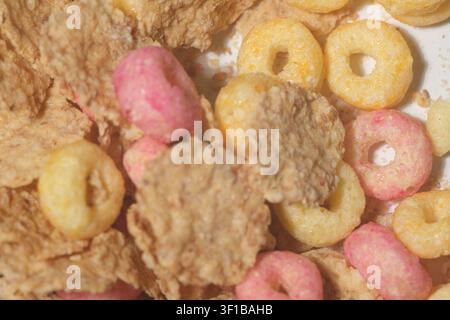 Golden corn flakes scattered on a white background Stock Photo