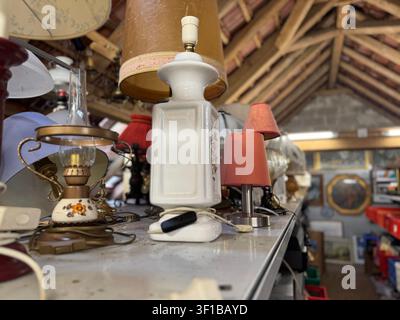 Assorted vintage table lamps on shop display shelf Stock Photo