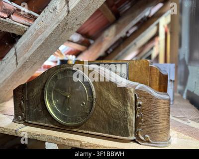 Vintage wooden desk clock with calendar on display shelf Stock Photo