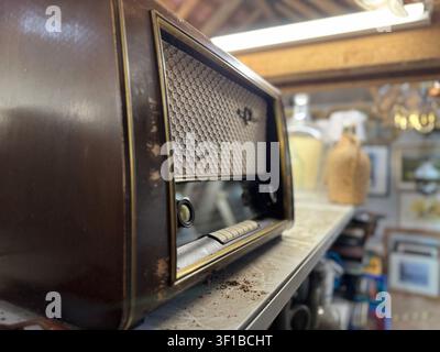 Vintage wooden radio receiver on display shelf Stock Photo