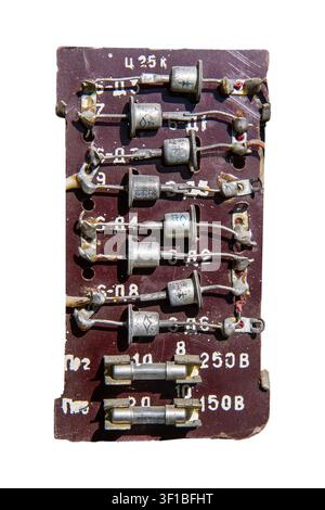 Old radio parts. Diodes on a printed circuit board. Radio details on a white background. Stock Photo