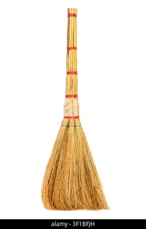 Broom isolated on a white background. Classic homemade broom close-up. Stock Photo
