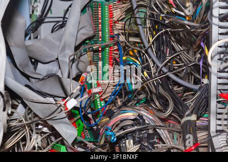 Bunch of connected server electrical cables in a distribution box. Stock Photo
