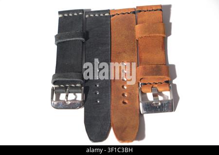 Close-up of premium genuine brown leather watch strap with detailed stitching and metal buckle Stock Photo