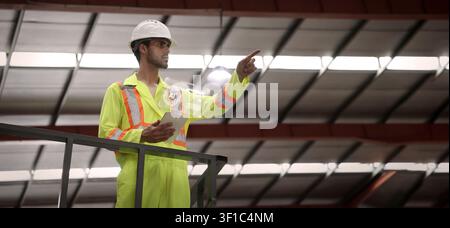 Ai using. Engineers and technicians use AI inspect industrial equipment. Worker using Ai digital tools and augmented reality technology to inspect ind Stock Photo