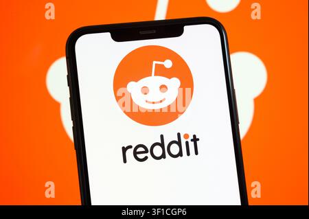 Paris, France - July 12, 2026: The orange Reddit alien logo displayed on a mobile screen. Stock Photo