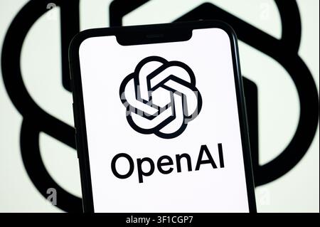 Paris, France - July 12, 2026: The white OpenAI spiral logo illuminated on a smartphone screen. Stock Photo