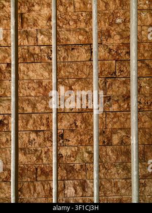 Germany 2026 Prison bars no action, in interior wall with stone tiles, with metal bars, stone tiles, from a static from outside looking in perspective Stock Photo
