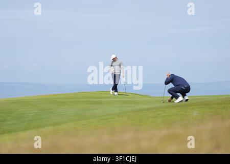 J.J. Spaun waits to putt on the first green during the second round of ...