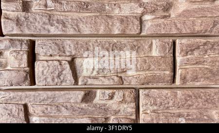 Brown decorative stone wall texture close up Stock Photo