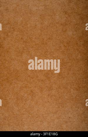 Background of thick packaging cardboard of beige color for design and craft. Stock Photo