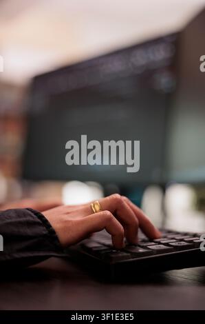 System engineer writing programming language on computer, using database code to develop server interface, freelance coder analyzing html script working in it development agency. Stock Photo