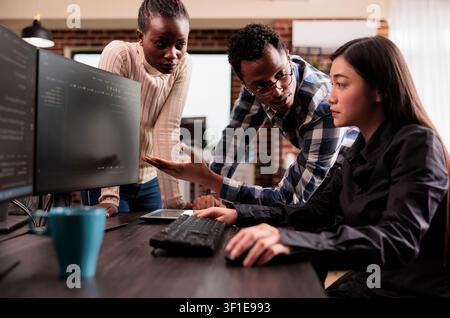 Diverse programmers discussing cloud interface code capturing looking at code on computer, working on server interface development, Programmers parsing cloud computing project with big data. Stock Photo