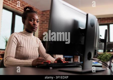 Database administrator updates cloud file processing with an advanced compression algorithm, supporting secure platform information flow. Stock Photo