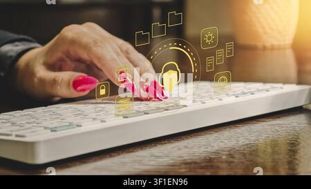 AI customer support and cybersecurity concept. Woman typing on keyboard with glowing digital helpdesk, privacy shield, and data protection icons. Stock Photo