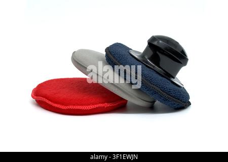A set of car detailing applicators including foam pads and microfiber covers for wax and polish application Stock Photo