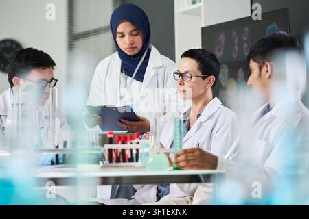 Multiethnic Scientists Collaborating on Medical Research in Lab Stock Photo