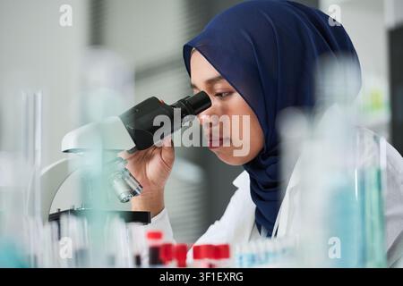 Young Female Scientist Examining Samples for Medical Research Stock Photo
