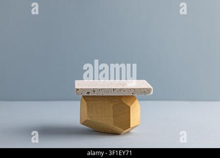 Minimalist Geometric Natural Stone and Wood Sculpture on Gray Background Stock Photo