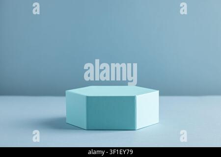 Minimalist Hexagonal Box on Monochromatic Blue Background for Modern Design Stock Photo