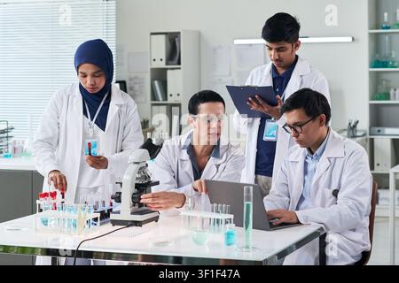 Diverse Medical Researchers Collaborating in Laboratory Team Stock Photo