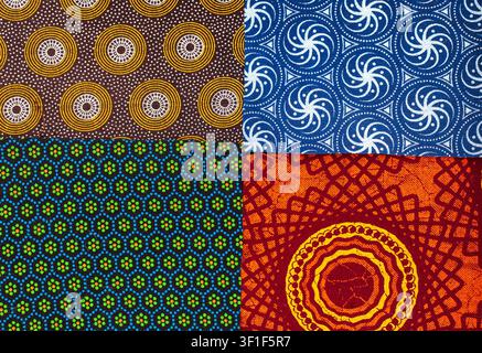 Vibrant patchwork background featuring four contrasting African patterned fabrics in blue, brown, yellow, green and black. A colorful textile composit Stock Photo