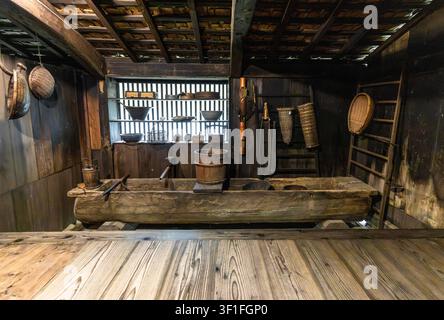 Ancient japanese farm kitchen with traditional wooden tools Stock Photo