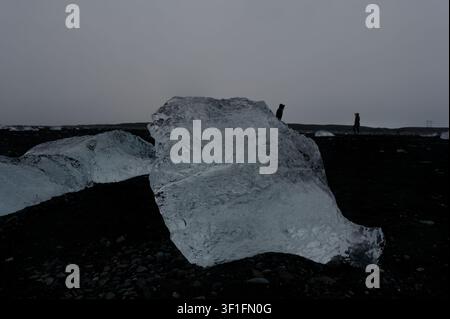 Glacial ice chunk on Diamond Beach’s black volcanic shore Stock Photo