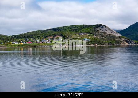 View across Bonne Bay Newfoundland Canada North America on a lovely June day to small community in Gros Morne National Park Stock Photo