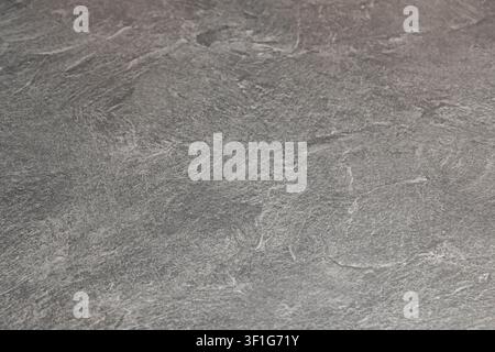 "Detailed View of Weathered Slate Stone Texture Featuring Subtle Grey Tones and Natural Cracks" Stock Photo