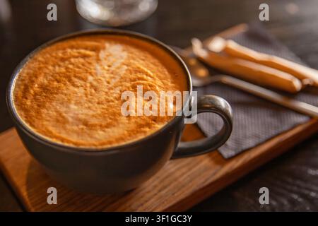 Fresh Cappuccino Coffee With Latte Art Served On Wooden Tray In Cozy Cafe Stock Photo