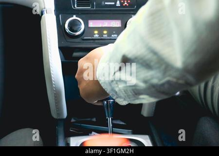 Hand Shifting Automatic Car Gear Lever Close Up Inside Modern Vehicle Stock Photo