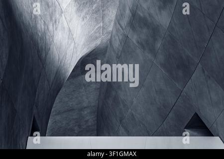 The interplay of light and shadow creates abstract geometric patterns on a dome. Stock Photo