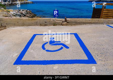 Wheelchair accessibility parking space marked on pavement in Chora, Andros, Greece Stock Photo