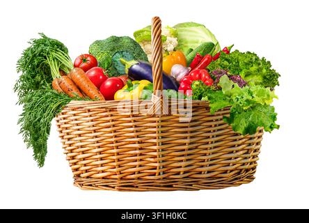 A beautifully arranged wicker basket overflowing with a variety of colorful fresh vegetables and greens isolated on white Stock Photo