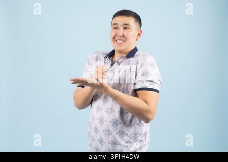 Young male thinking deeply about problem with hand near his chin Stock Photo